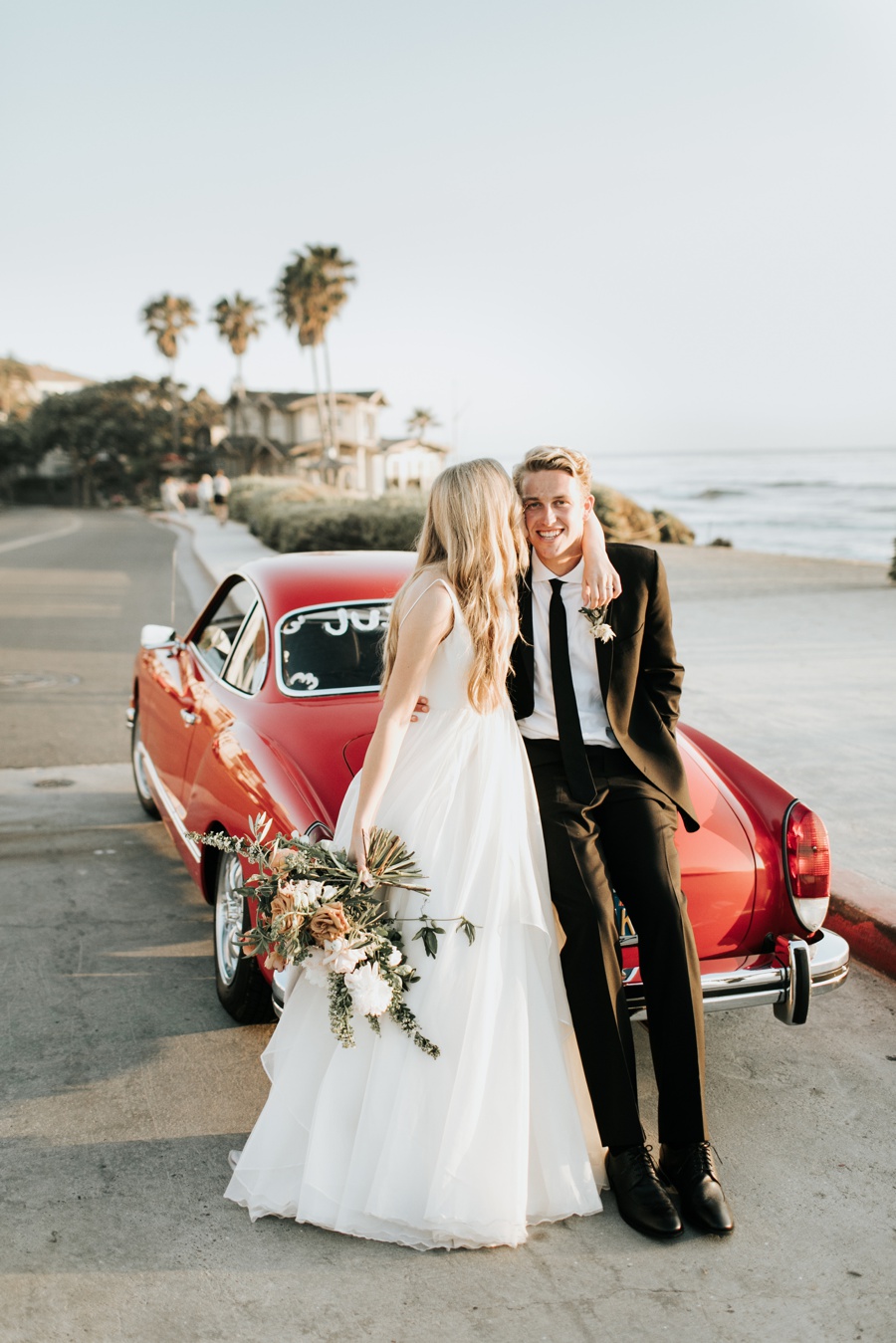 romantic darlington house wedding, la jolla california, vintage red car, just married, San Diego cliffs, palm trees