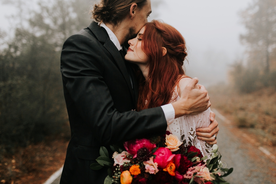 cuddly bride and groom intimate bohemian wedding photography