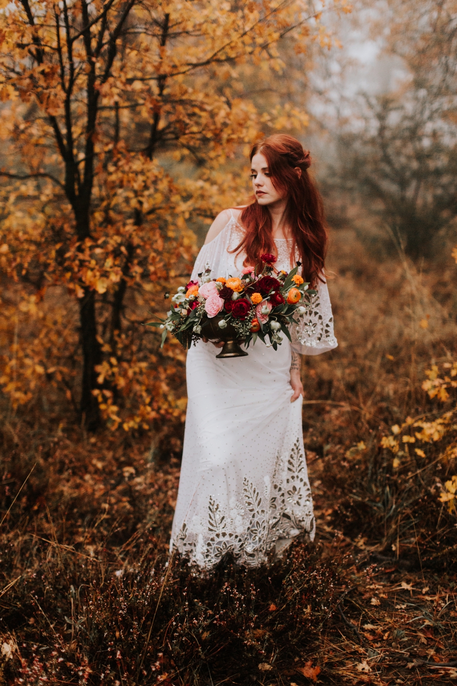 rue de siene wedding dress in the forest, yellow fall leaves bride and groom